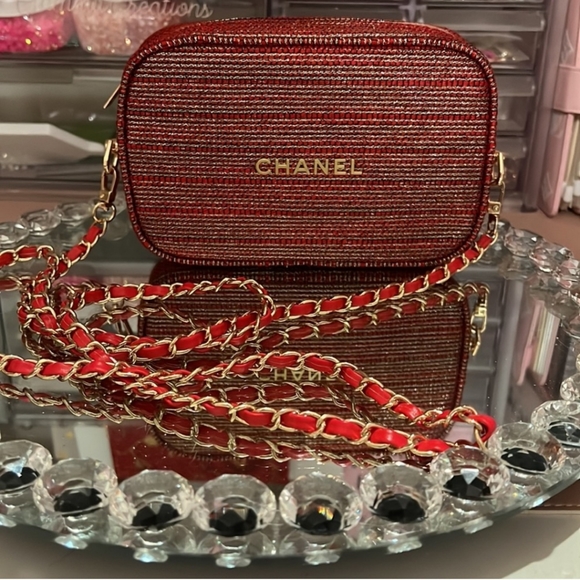 CHANEL Handbags - Chanel Pouch crossbody with red and gold 47-inch chain.